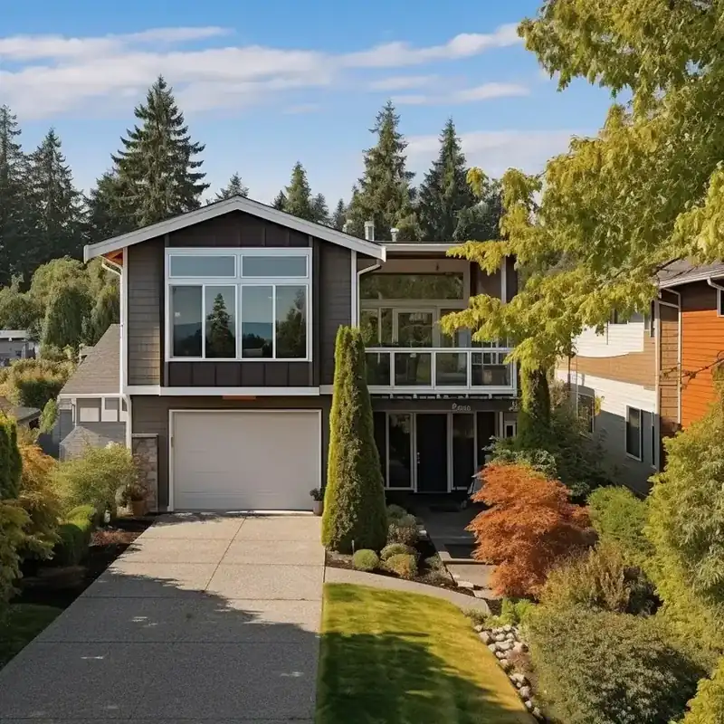 Modern Northwest home surrounded by established trees and shrubs